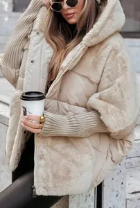 Detail of women's beige puffer jacket with faux fur splicing and ribbed sleeves.