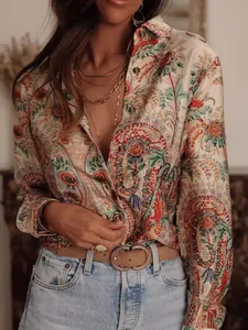 Detailed shot of bohemian long-sleeved shirt featuring vintage paisley floral print pattern