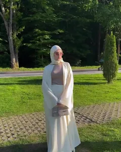 Elegant cream two-piece long robe and skirt set for women in outdoor garden