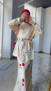 Full body view of elegant floral print skirt and shirt set with modest hijab styling