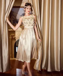Elegant champagne satin evening dress with gold sequined bodice and vintage Gatsby style