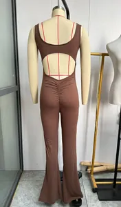 Back view of a slim-fit brown yoga jumpsuit with back cutout on a mannequin