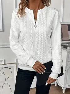 Detailed macro view of a white cable knit textured half-zip sweatshirt for women