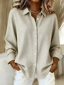 Detailed view of women's beige gingham long sleeve shirt with classic lapel and buttons
