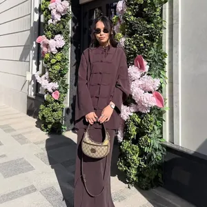 Elegant outdoor view of the brown imitation linen New Chinese style long shirt and skirt set