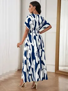 Back view of a printed high-waisted maxi dress with abstract blue and white patterns.