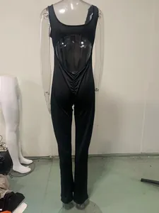 Back detail view of black hollow-out yoga bodysuit on a transparent mannequin