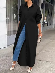 Stylish plus size black long-sleeved shirt tunic worn by a model on a city street