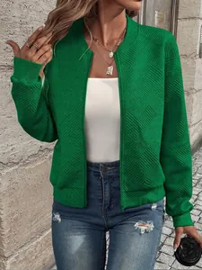 Detailed view of green women's zip-up bomber jacket with textured diamond pattern.