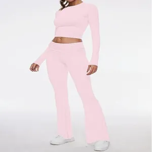 Pink two-piece tight long-sleeve crop top and low waist flared pants set for women