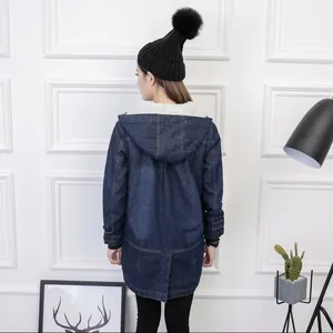 Back view of a thick fleece-lined denim parka with a cozy white faux fur hood