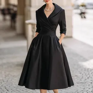 Elegant black satin maxi dress with cinched waist and long sleeves for sophisticated women