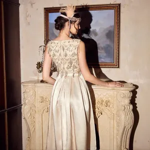 Vintage-style champagne satin maxi dress with sequins and beads for evening gala events