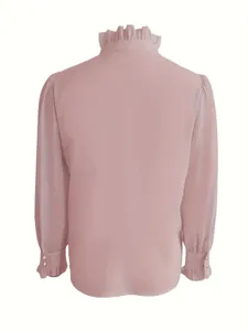 Back view of elegant pink long-sleeved blouse with ruffled high neck and cuffs