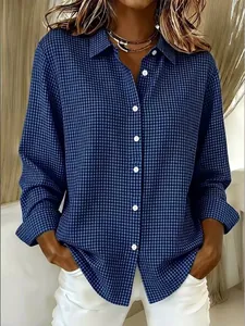 Close-up of a stylish blue checkered long-sleeve shirt with a classic turn-down collar.