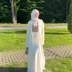 Elegant cream cotton linen two-piece set with long cardigan and skirt in garden