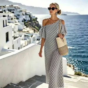 Elegant black and white striped off-shoulder maxi dress, perfect for sea beach vacations.