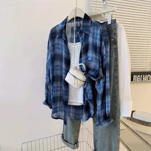 Blue plaid chiffon sun protection shirt detail showing lightweight fabric and styling.