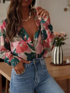 Stylish women's printed long-sleeved holiday shirt with vibrant abstract leaf patterns