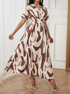 Elegant brown and cream abstract print wrap dress with cinched waist and short sleeves