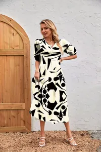 Full-body view of a women's dress featuring bold geometric black and white prints
