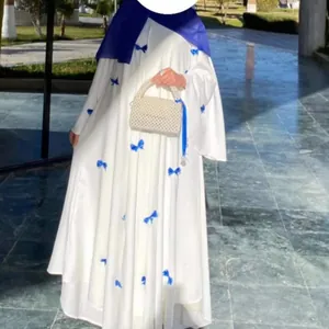 Elegant plus size white maxi dress with blue bow decorations and stylish flare sleeves