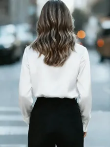 Back view of elegant white satin long sleeve blouse for professional women