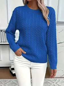 Detailed texture of a classic blue cable-knit crewneck sweater in a stylish studio setting