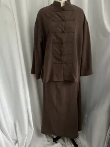 Detailed studio shot of a brown linen-look oriental style shirt and skirt set