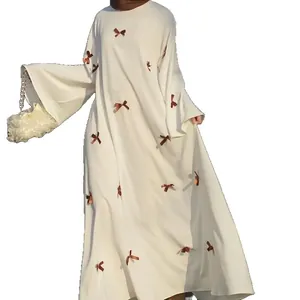 Elegant white plus size bell sleeve maxi dress with brown bow accents