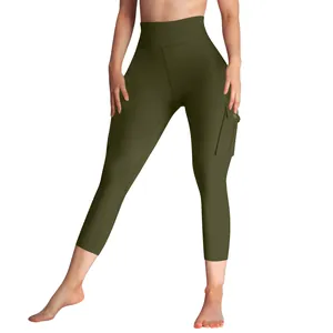Detail view of olive green high waist cargo yoga leggings with side pocket for women.