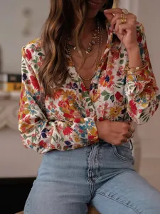 Detail view of women's vibrant floral long-sleeve blouse with lapel collar for vacation