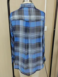 Detailed view of the blue plaid chiffon fabric on a lightweight women's summer sun shirt.