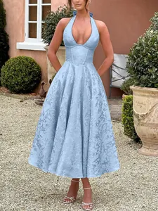 Detail view of light blue jacquard halter neck dress with deep V-neckline and open back
