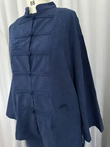 Detail view of navy blue Neo-Chinese shirt featuring traditional frog buttons and linen texture