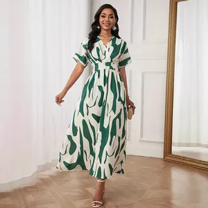 Elegant white and green floral print maxi dress with V-neck and cinched waist for women
