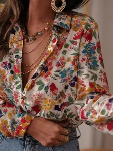 Close-up detail of a vibrant floral print on a women's long sleeve lapel resort blouse