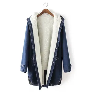 Detailed shot of a women's mid-length denim jacket featuring a warm white fleece lining