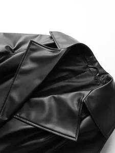 Black faux leather trench coat with stylish wide lapel and smooth texture