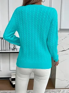 Detailed back view of a turquoise cable-knit long-sleeve sweater with a ribbed hem