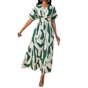 Elegant women's maxi dress featuring a vibrant green abstract print and high-waisted design