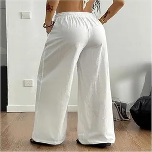 Detailed back view of women's white linen wide leg pants showing loose casual fit