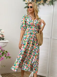 Detailed view of women's floral print dress with V-neck and puff sleeves
