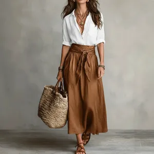 Women's two-piece fashion set with white linen shirt and brown tie-waist maxi skirt.
