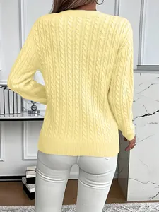 Detailed back view of a classic yellow cable-knit long sleeve crewneck sweater for women