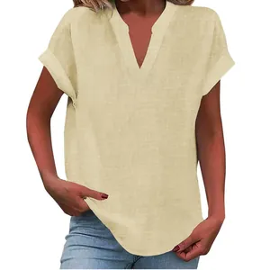 Close-up of women's short-sleeve V-neck blouse with linen-like texture and rolled cuffs