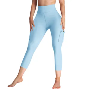 Detail view of light blue cargo yoga pants with high waist and side pockets for women