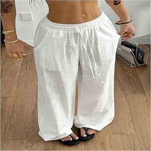 Detailed view of breathable white cotton linen wide-leg trousers with drawstring