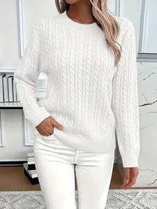 Detailed view of women's elegant white cable knit sweater with classic ribbed crew neck