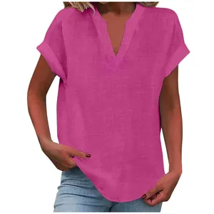 Close-up detail of magenta V-neck short sleeve blouse for women with soft linen texture.